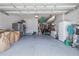 Organized two-car garage with ample storage space and epoxy flooring for a clean and functional area at 1432 Gopher Loop, Tarpon Springs, FL 34689