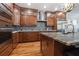 A luxurious kitchen boasts granite countertops, stainless steel appliances, and custom wood cabinets at 1432 Gopher Loop, Tarpon Springs, FL 34689