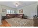 Spacious living room with hardwood flooring, a large carpet, and ample natural light at 1432 Gopher Loop, Tarpon Springs, FL 34689