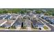 Street view of new homes, featuring two-story construction and well-manicured landscaping at 1432 Gopher Loop, Tarpon Springs, FL 34689