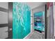 Bathroom leading to the pool, showcasing a mermaid mural at 14702 Dartmoor Ln, Tampa, FL 33624