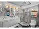 Contemporary bathroom with double sink vanity, frameless glass shower, and modern fixtures at 14702 Dartmoor Ln, Tampa, FL 33624