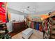 Spacious walk-in closet with custom storage, ottoman, and shelves at 14702 Dartmoor Ln, Tampa, FL 33624