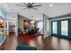 Modern dining room with stylish decor and wood floors leading to french doors at 14702 Dartmoor Ln, Tampa, FL 33624