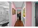 Hallway with handbag display, closet, and full bathroom at 14702 Dartmoor Ln, Tampa, FL 33624