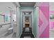 Hallway with mirrored doors and custom, geometric wall design at 14702 Dartmoor Ln, Tampa, FL 33624