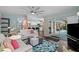 Open-concept living room with views into the kitchen and access to the pool at 14702 Dartmoor Ln, Tampa, FL 33624