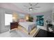This is a main bedroom featuring a large bed, unique platform and a sliding door to the pool at 14702 Dartmoor Ln, Tampa, FL 33624