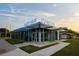 Well-lit, modern nature center with unique architectural details and inviting entrance on a sunny day at 14702 Dartmoor Ln, Tampa, FL 33624