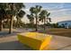 A park sign offers an inviting place with palm trees and verdant landscaping for outdoor relaxation at 14702 Dartmoor Ln, Tampa, FL 33624