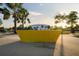 The Carrolwood Village Park sign stands near palm trees and lush greenery for a welcoming experience at 14702 Dartmoor Ln, Tampa, FL 33624
