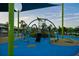 Colorful playground area with rope climbing structures, slides, and soft play surfaces, perfect for active  at 14702 Dartmoor Ln, Tampa, FL 33624