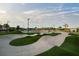 The concrete skate park, integrated with green turf, enhances community engagement with open space at 14702 Dartmoor Ln, Tampa, FL 33624
