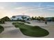 An inviting concrete skate park offers ramps and green turf, suitable for both skateboarders and spectators at 14702 Dartmoor Ln, Tampa, FL 33624