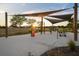 Open-air workout area with sunshades and exercise equipment, providing a great space for outdoor fitness at 14702 Dartmoor Ln, Tampa, FL 33624