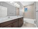 Bathroom with a double vanity, tile floors, and a shower-tub combination at 14718 Rocky Brook Dr, Tampa, FL 33625
