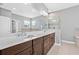 Bathroom featuring double vanity with a marble countertop, and a glass shower at 14718 Rocky Brook Dr, Tampa, FL 33625