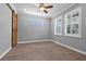 Comfortable office space with wood-look floors, modern paint color, and bright natural light at 14718 Rocky Brook Dr, Tampa, FL 33625