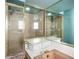 Bathroom featuring glass shower, gold trim, mosaic tile and pink tub at 1623 Carter Oaks Dr, Valrico, FL 33596