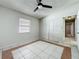 Bright bedroom with tile floors, ceiling fan and closet at 1623 Carter Oaks Dr, Valrico, FL 33596