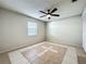 Bright bedroom with tile floors and ceiling fan at 1623 Carter Oaks Dr, Valrico, FL 33596