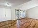 Large living room featuring vinyl flooring, large windows, and a brightly lit entryway at 1623 Carter Oaks Dr, Valrico, FL 33596