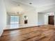 Open-concept living area with tile floors, updated lighting, and sliding glass doors to a pool at 1623 Carter Oaks Dr, Valrico, FL 33596