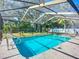 Backyard swimming pool with screened enclosure at 1623 Carter Oaks Dr, Valrico, FL 33596