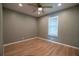 Cozy bedroom with wood floors, neutral walls, and a ceiling fan at 1716 11Th N Ave, St Petersburg, FL 33713