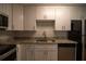 Well-equipped kitchen with granite countertops and stainless steel dishwasher at 1716 11Th N Ave, St Petersburg, FL 33713
