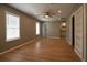 Inviting living room with wood floors that seamlessly connects to the kitchen at 1716 11Th N Ave, St Petersburg, FL 33713