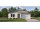 Charming single-story home featuring a two-car garage and manicured front lawn at 18468 Serene Lake Loop, Lutz, FL 33548