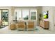 Bright living room with comfortable seating, large windows, and a view to the outdoors at 18468 Serene Lake Loop, Lutz, FL 33548