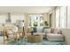 Comfortable living room with L-shaped couch, bright windows, and open-concept design at 18468 Serene Lake Loop, Lutz, FL 33548