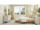 Bright main bedroom with natural light, comfortable bed, and stylish furnishings at 18468 Serene Lake Loop, Lutz, FL 33548