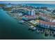 Gorgeous aerial view showcases complex, pool, boat slips, and stunning Gulf of Mexico and coastal waterway access at 19111 Vista Bay Dr # 603, Indian Shores, FL 33785