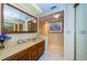 Clean bathroom with vanity, tile floors, and framed mirror at 19111 Vista Bay Dr # 603, Indian Shores, FL 33785