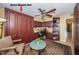This bedroom boasts a Murphy bed, built-in cabinets, ceiling fan, and a well-lit workspace at 19111 Vista Bay Dr # 603, Indian Shores, FL 33785
