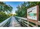 Explore nature along this elevated boardwalk with informative signage and lush greenery at 19111 Vista Bay Dr # 603, Indian Shores, FL 33785