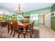 Formal dining room featuring a wooden table and chairs, a decorative mirror, and neutral decor at 19111 Vista Bay Dr # 603, Indian Shores, FL 33785