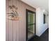 Welcoming entryway featuring a security door, neutral decor, and a charming wall decoration at 19111 Vista Bay Dr # 603, Indian Shores, FL 33785