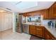Well-equipped kitchen with granite countertops, stainless steel appliances, and ample cabinet space at 19111 Vista Bay Dr # 603, Indian Shores, FL 33785