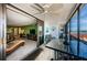 Living room with sliding glass doors to lanai, and lanai overlooking water views at 19111 Vista Bay Dr # 603, Indian Shores, FL 33785