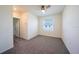 Bright bedroom with plush carpeting, neutral walls, and a window with blinds at 1926 Pleasant Maple Ct, Bradenton, FL 34211