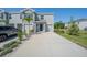 Charming townhome featuring a light gray facade, well-manicured landscaping, and a private driveway at 1926 Pleasant Maple Ct, Bradenton, FL 34211