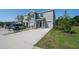Two-story townhome with light gray exterior, garage, and manicured lawn at 1926 Pleasant Maple Ct, Bradenton, FL 34211