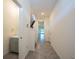 Hallway leading to the stairs with a view of the downstairs bathroom at 1926 Pleasant Maple Ct, Bradenton, FL 34211
