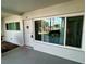 Entrance with a decorative door and large window at 2020 World Parkway Blvd # 14, Clearwater, FL 33763