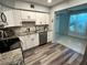 Updated kitchen with stainless steel appliances and modern cabinets at 2020 World Parkway Blvd # 14, Clearwater, FL 33763