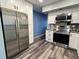 Kitchen with stainless steel appliances and white cabinets at 2020 World Parkway Blvd # 14, Clearwater, FL 33763